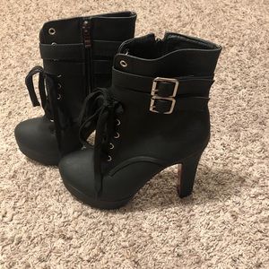 Vero Cuoio high-heeled red bottom boots.